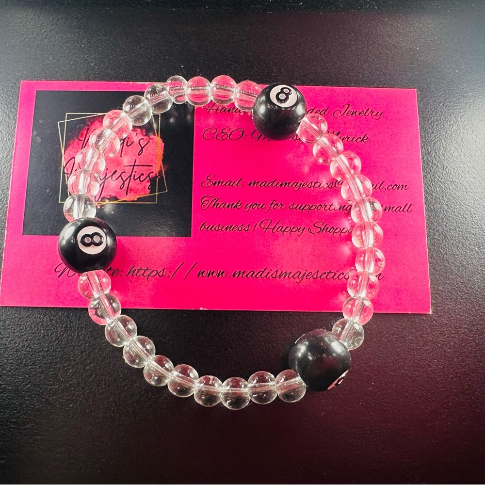 Majestic Black Bracelet with Crystal-like Beads and Striking Contrast